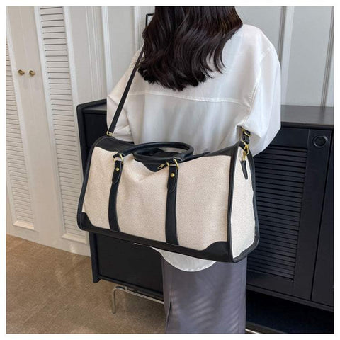 Large Capacity Purse with black accents and shoulder strap, perfect for stylish organization.