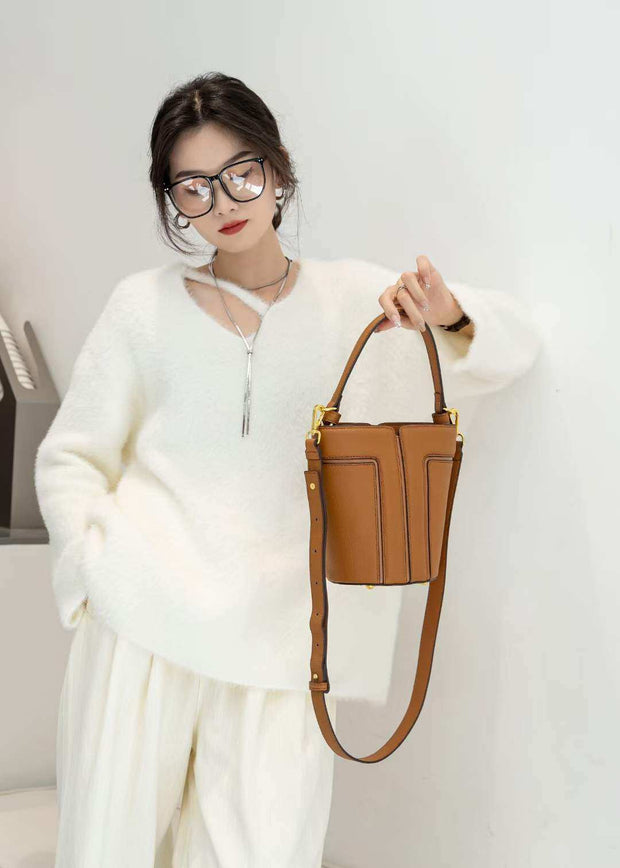 Large Capacity Shoulder Bag with single strap in golden brown, showcased with a chic outfit.