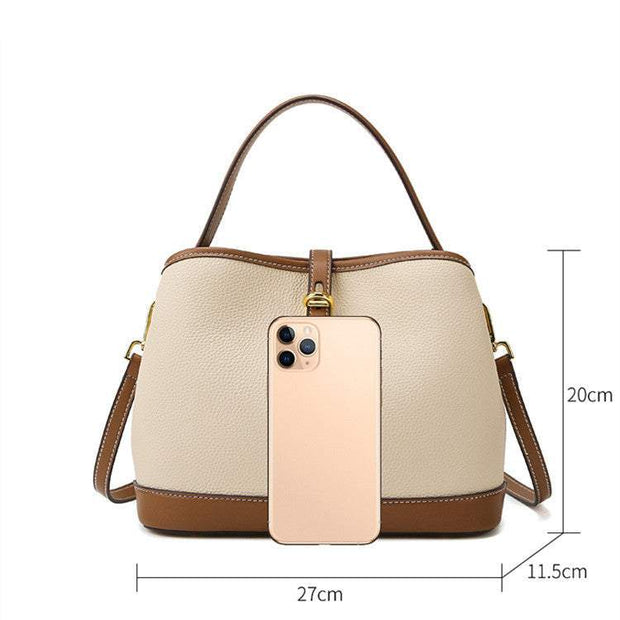 Milky white Ladies Messenger Bag with adjustable strap and spacious interior, featuring a bucket shape design, made from durable PU material.