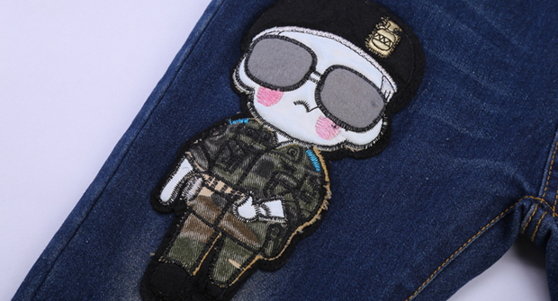 Boys Blue Jeans with cartoon patch detail on dark denim.