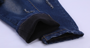 Boys blue jeans with durable denim and reinforced stitching.