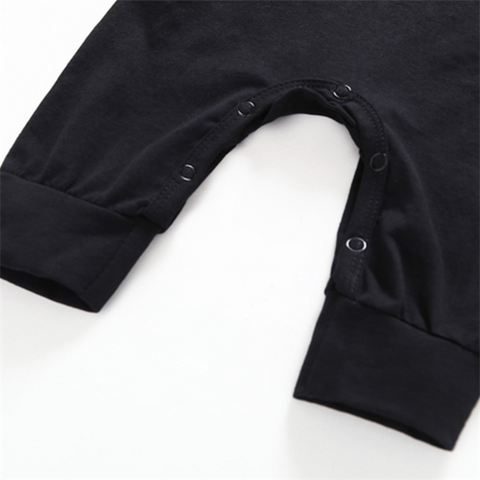 Batman Baby Onesie with snap closures for easy dressing and diaper changes.
