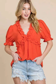 Lime N Chili Ruffled Puff Sleeve Babydoll Top in vibrant orange with deep V-neckline, ruffled details, and puff sleeves.