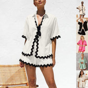 Stylish 2 Piece Summer Suit in white with black trim, perfect for warm weather occasions.