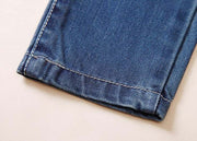 Close-up of European Style Boys Ripped Jeans showcasing durable denim fabric with reinforced stitching.