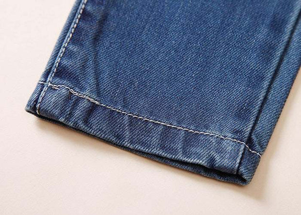 Close-up of European Style Boys Ripped Jeans showcasing durable denim fabric with reinforced stitching.