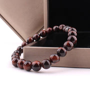 Red Tiger Eye Bracelet with polished beads in a gift box.