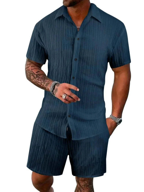 Plus size button down shorts set in dark blue with a classic collar and short sleeves, designed for comfort and style.