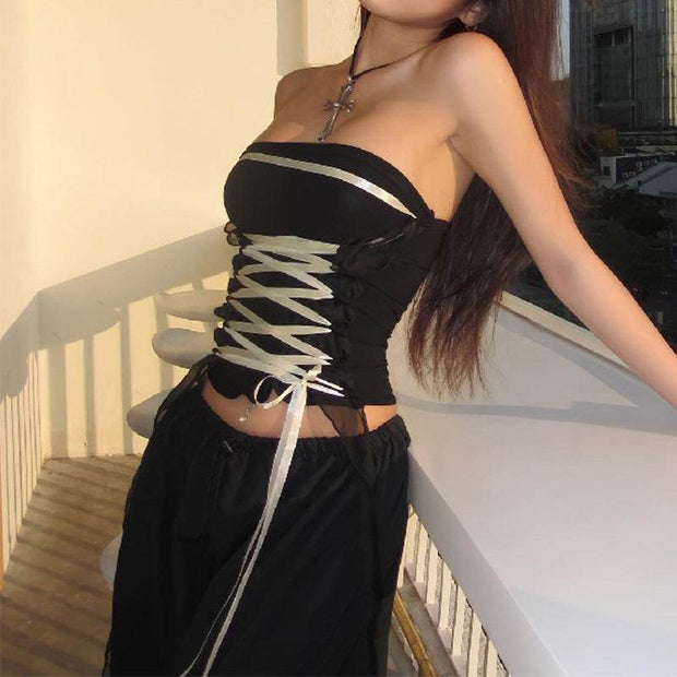 Lace-up tube top with adjustable front lacing, worn outdoors.
