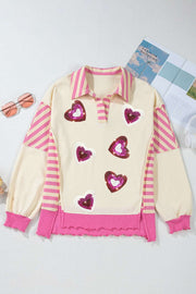 Pink sequin heart collared top with playful design and vibrant colors.