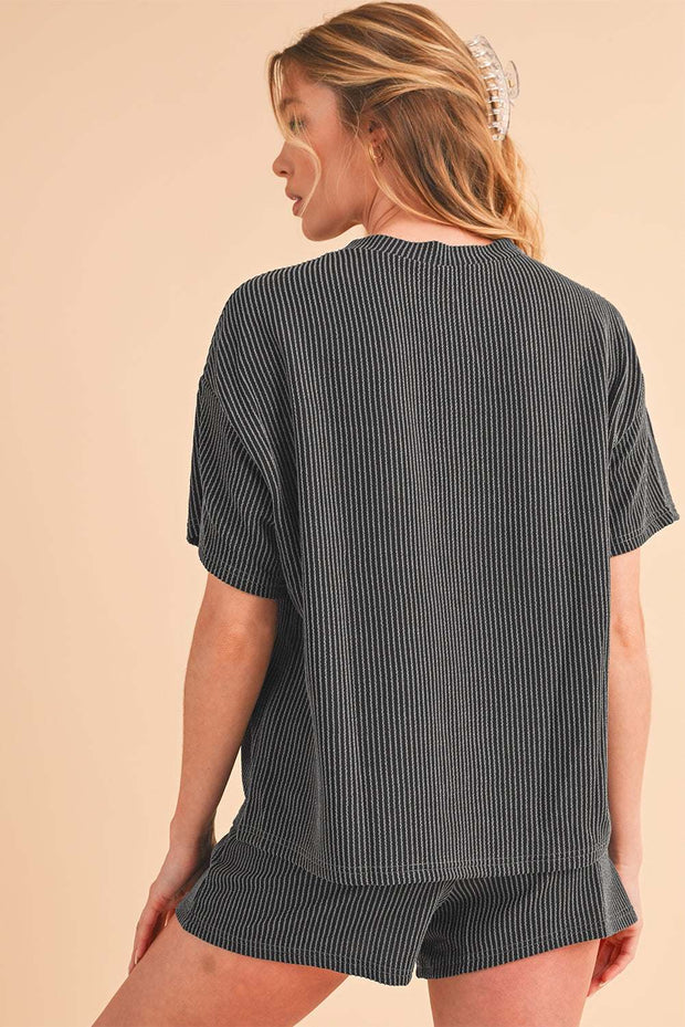 Orange ribbed tee and shorts set, featuring a stylish loose-fit design and vibrant color.