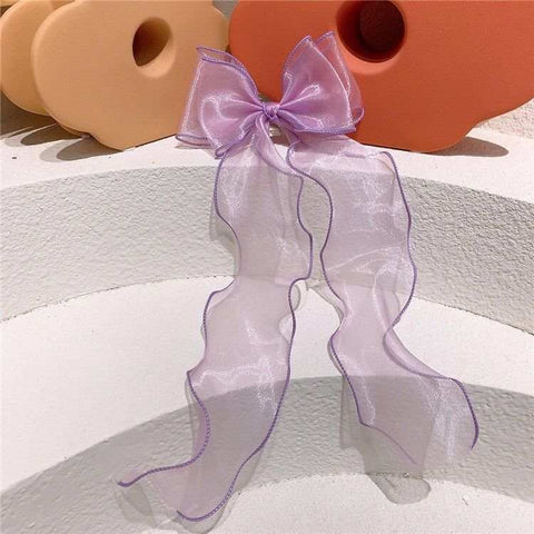 Children's bow hairpin in vibrant lace design, ideal for girls' hairstyles, combining style and comfort.