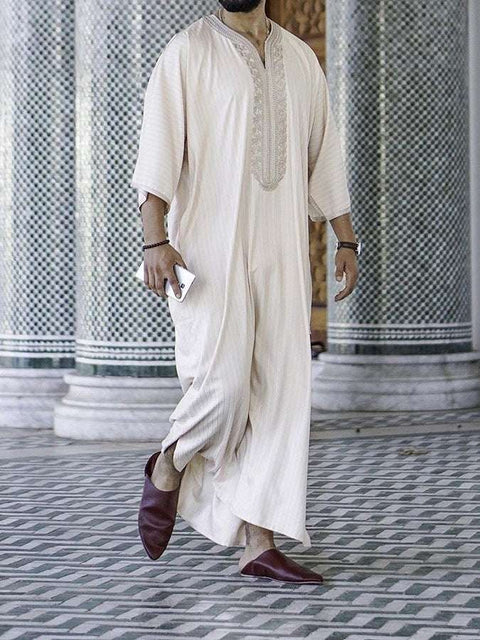 Embroidery White Muslim Robe with intricate detail and milky white fabric.