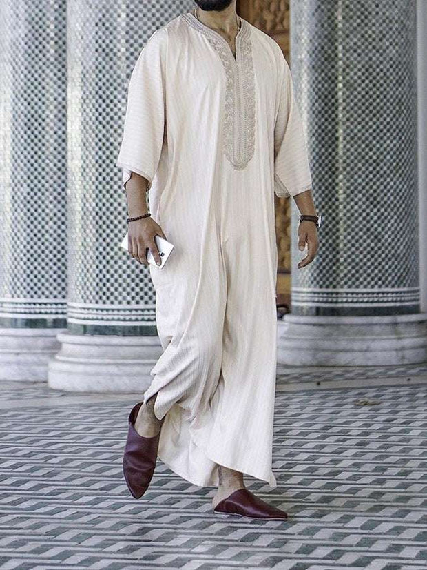 Embroidery White Muslim Robe with intricate detail and milky white fabric.