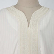 Intricately embroidered neckline of the Embroidery White Muslim Robe, showcasing elegance.