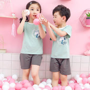 Youth wearing cotton short-sleeve suit with cartoon print, ideal for summer comfort and style.