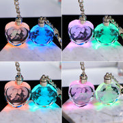 Crystal keychain with customizable photo display, illuminated with multiple colors.