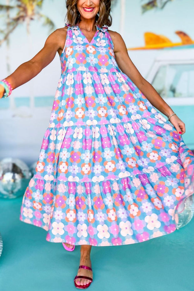 Vibrant 60s Flower Maxi Dress with colorful floral print and tiered silhouette.
