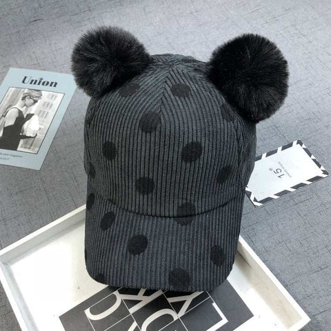 Ball Peaked Hat with two pom-poms, dark gray with dot pattern, stylish sun protection accessory.