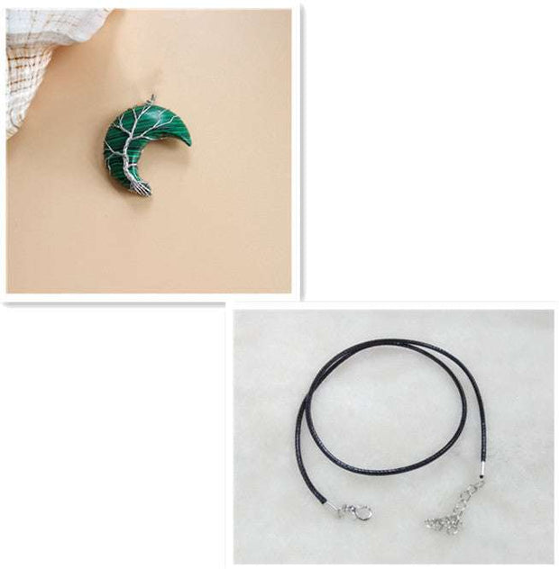 Moon Tree Of Life Necklace with crescent-shaped tree of life pendant and black leather rope.