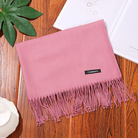 Luxurious pink designer scarf shawl with fringe detailing, perfect for versatile styling and elegance.