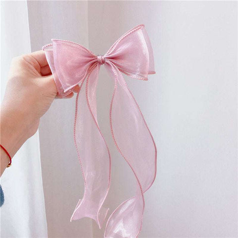 Children's bow hairpin with pink lace design, perfect accessory for girls.