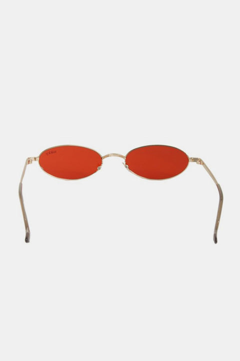Nicole Lee Finley Oval Metal Frame Sunglasses with red lenses and sleek metal design.