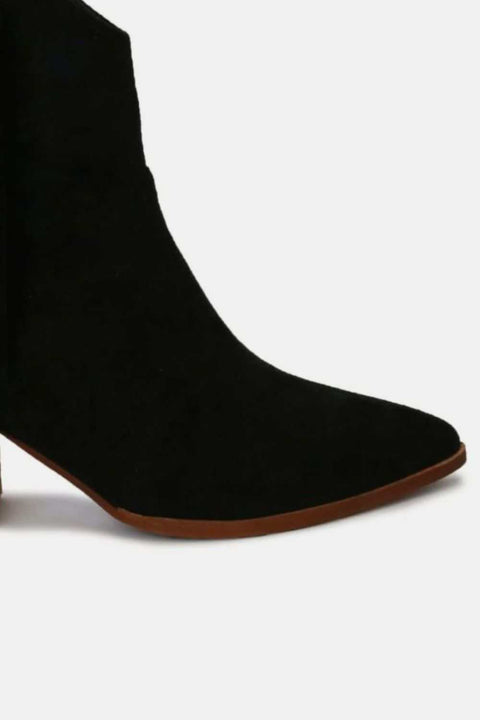 Beast Suede Fringe Ankle Boots in black suede with mid heel, featuring stylish fringe detail for trendy look.
