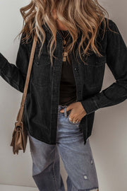 Black denim button-up jacket with long sleeves and chest pockets, paired with casual jeans and accessories.