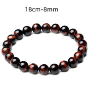 Red Tiger Eye Bracelet with polished beads on an 18cm elastic band.