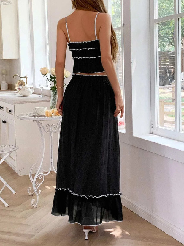Chic black frill square neck cami and skirt set in elegant kitchen setting.