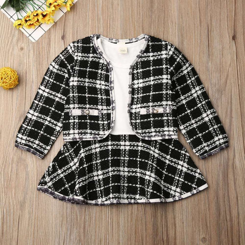 Two Piece Children Wind Suit in black plaid pattern with matching jacket and skirt.