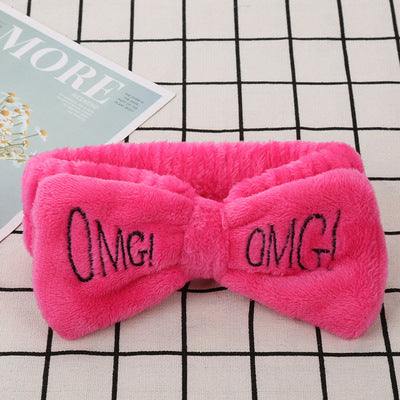 Coral Velvet Butterfly Hair Band with "OMG" text, soft velvet material, vibrant coral hue.