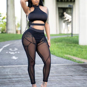 Women's mesh leggings in stylish black with elegant design, perfect for gym or casual outings.