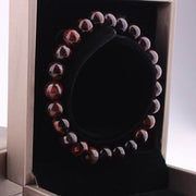 Red Tiger Eye Bracelet with polished beads in an elegant box.