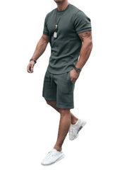 Plus Size Short Sleeve Top and Shorts Set in green, featuring a crew neckline and elastic waistband with drawstring.