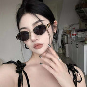 Vintage-inspired women's sunglasses with metal oval frames, UV400 protection, and a sleek, timeless design.