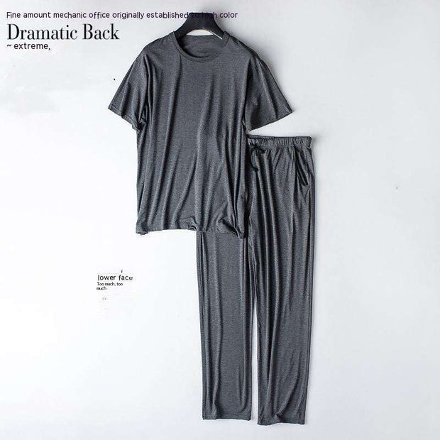 Gray two-piece home wear suit hanging on wall, featuring cozy top and matching bottoms for comfort and style.