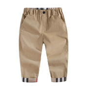 Boys casual cotton trousers with elastic waistband and pockets, khaki color, modern fit.