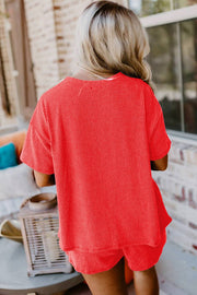 Orange ribbed tee and shorts set, vibrant color, casual outfit.