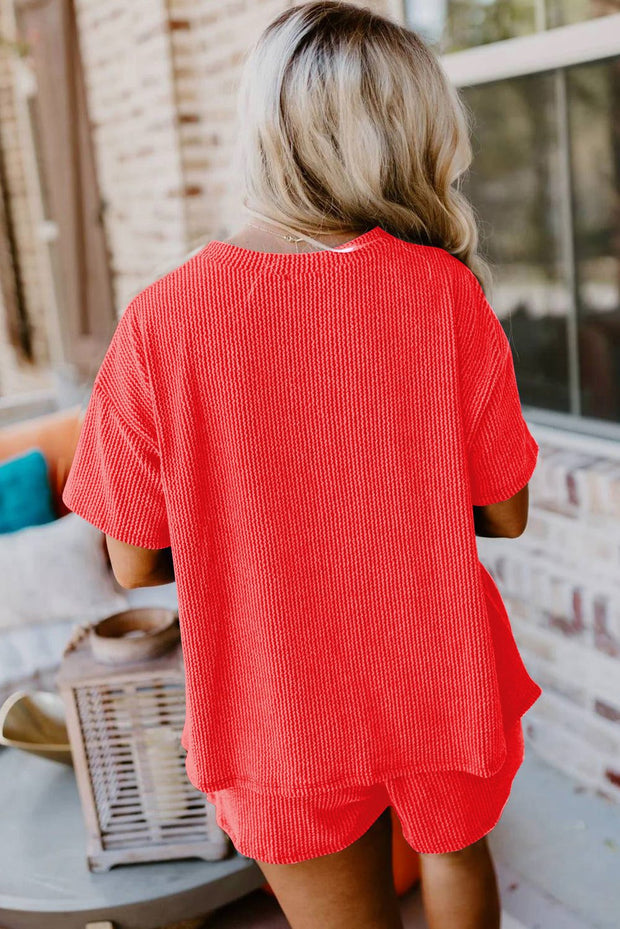 Orange ribbed tee and shorts set, vibrant color, casual outfit.