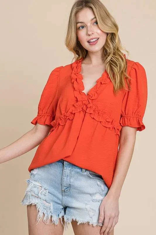 Lime N Chili Ruffled Puff Sleeve Babydoll Top with deep V-neckline and ruffled details in vibrant orange.