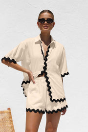 Stylish cream 2 Piece Summer Suit with black trim, ideal for warm weather events.