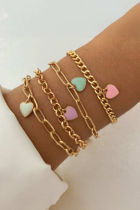 Gold Heart Adjustable Bracelet with heart charms and gold chains on wrist.
