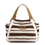 Stylish One-Shoulder Tote with canvas lining and spacious interior, featuring multiple compartments and elegant design.