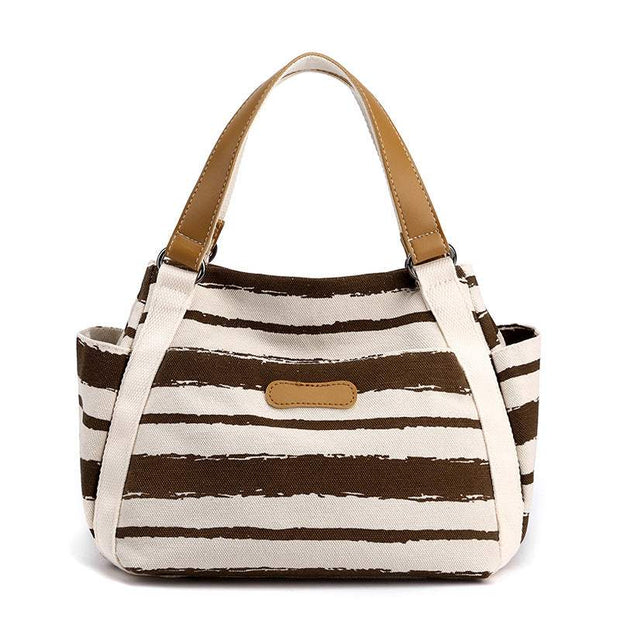 Stylish One-Shoulder Tote with canvas lining and spacious interior, featuring multiple compartments and elegant design.