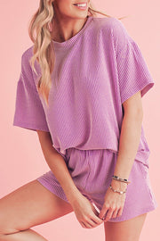 Woman in stylish ribbed tee and shorts set.