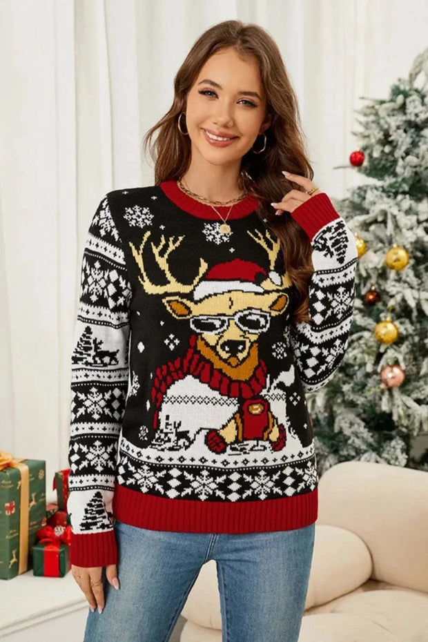 Woman wearing a festive Christmas pattern long sleeve sweater with reindeer design and red accents