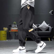 Casual Velvet Padded Pants in black, featuring elastic waistband and ankle strap design, ideal for style and comfort in cooler weather.