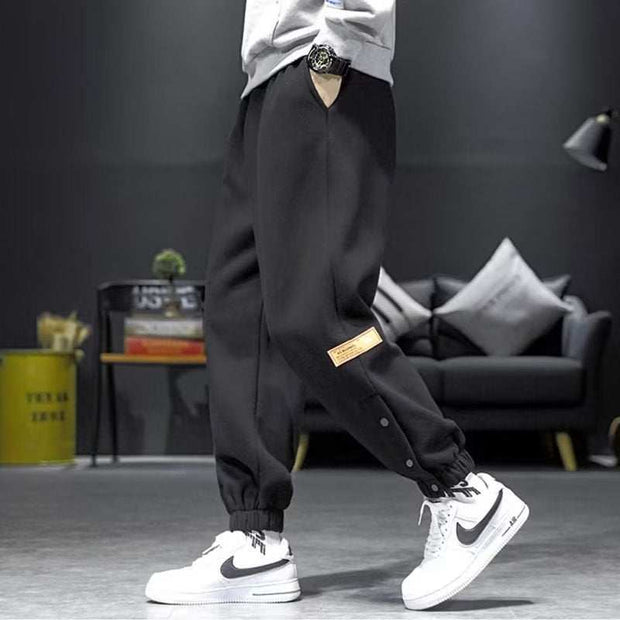 Casual Velvet Padded Pants in black, featuring elastic waistband and ankle strap design, ideal for style and comfort in cooler weather.